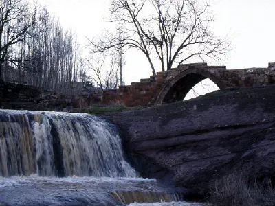 Old Seljuk bridge and waterfall at Ahlat