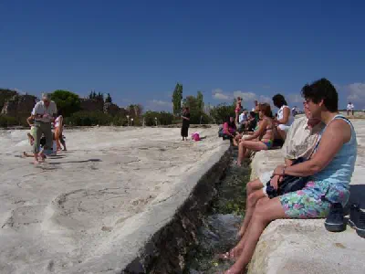 Some people believe that the water has a power for healing. So they put their foots to water way.
