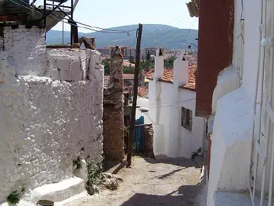 A Muğla street with old houses.