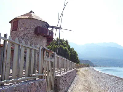 On the left there is a restored Windmill. On the right you can see the Körmen port. There is ferryboat sailing from/to Bodrum.
